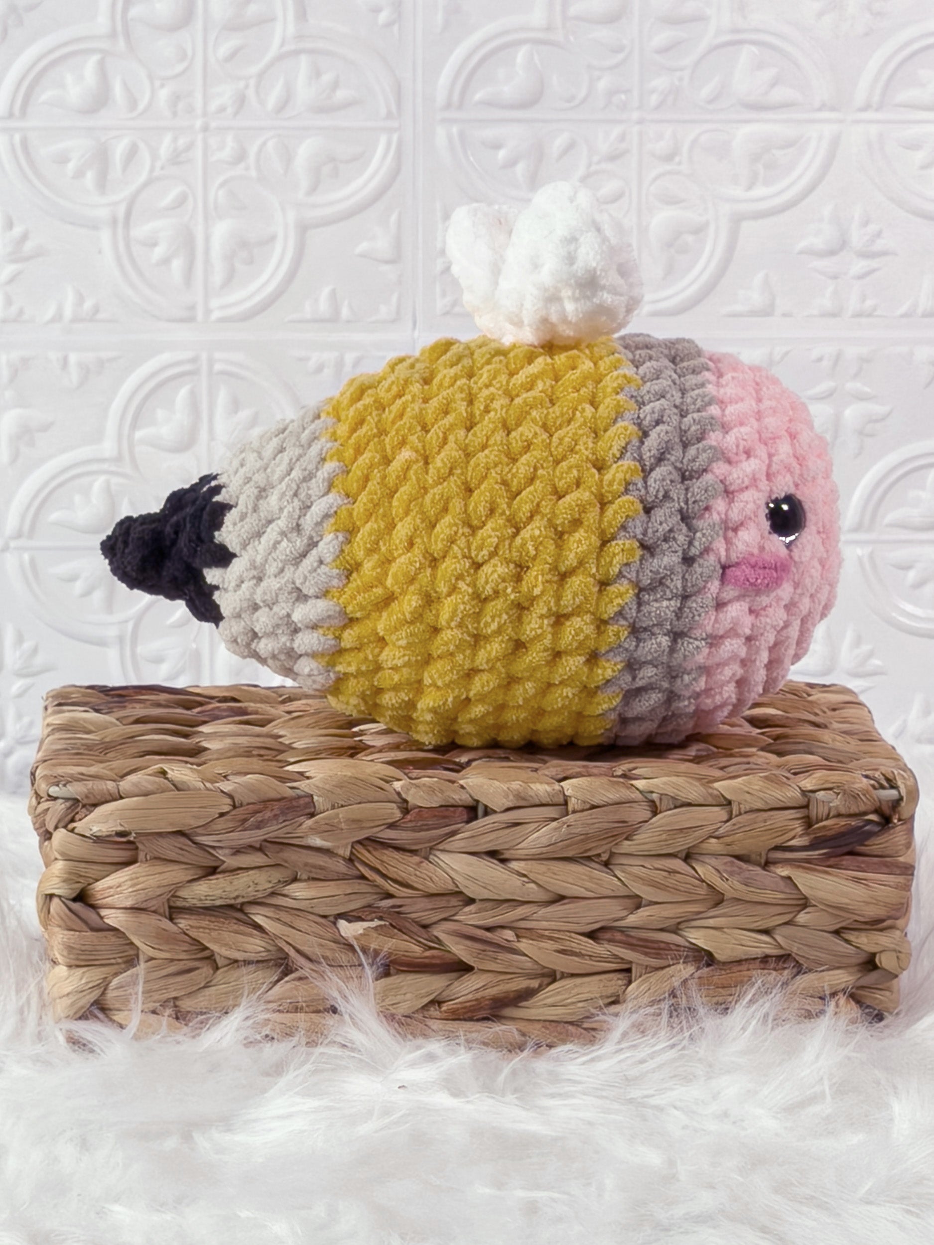 Handmade yellow bee pencil crochet plushie shown from the side