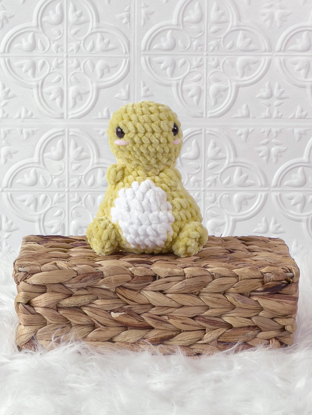 Handmade yellow chunky dino crochet plushie shown from the front