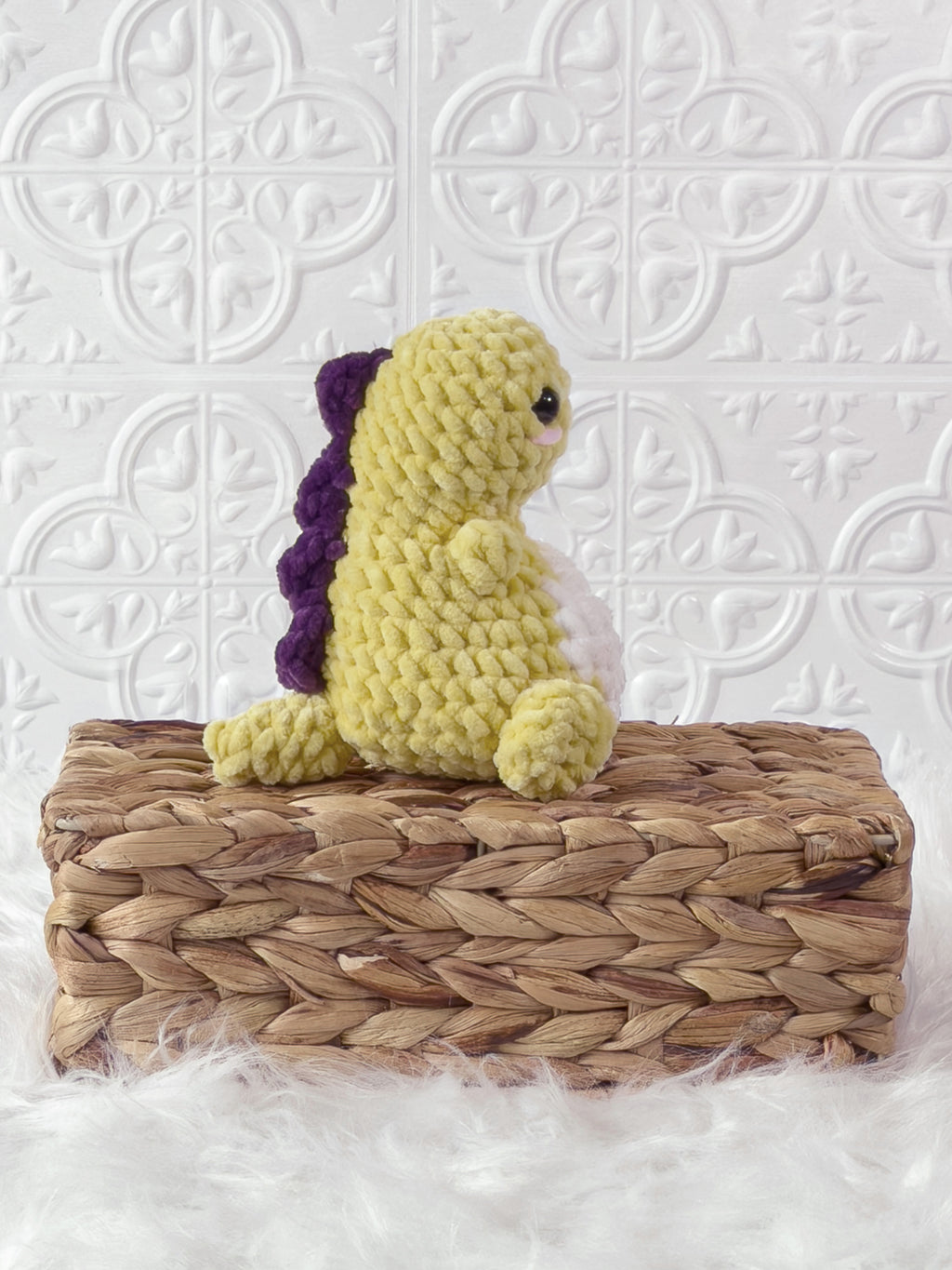 Handmade yellow chunky dino crochet plushie shown from the side