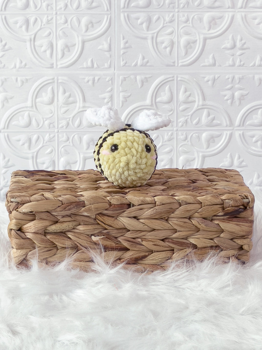Handmade yellow mini bee crochet plushie shown from the front