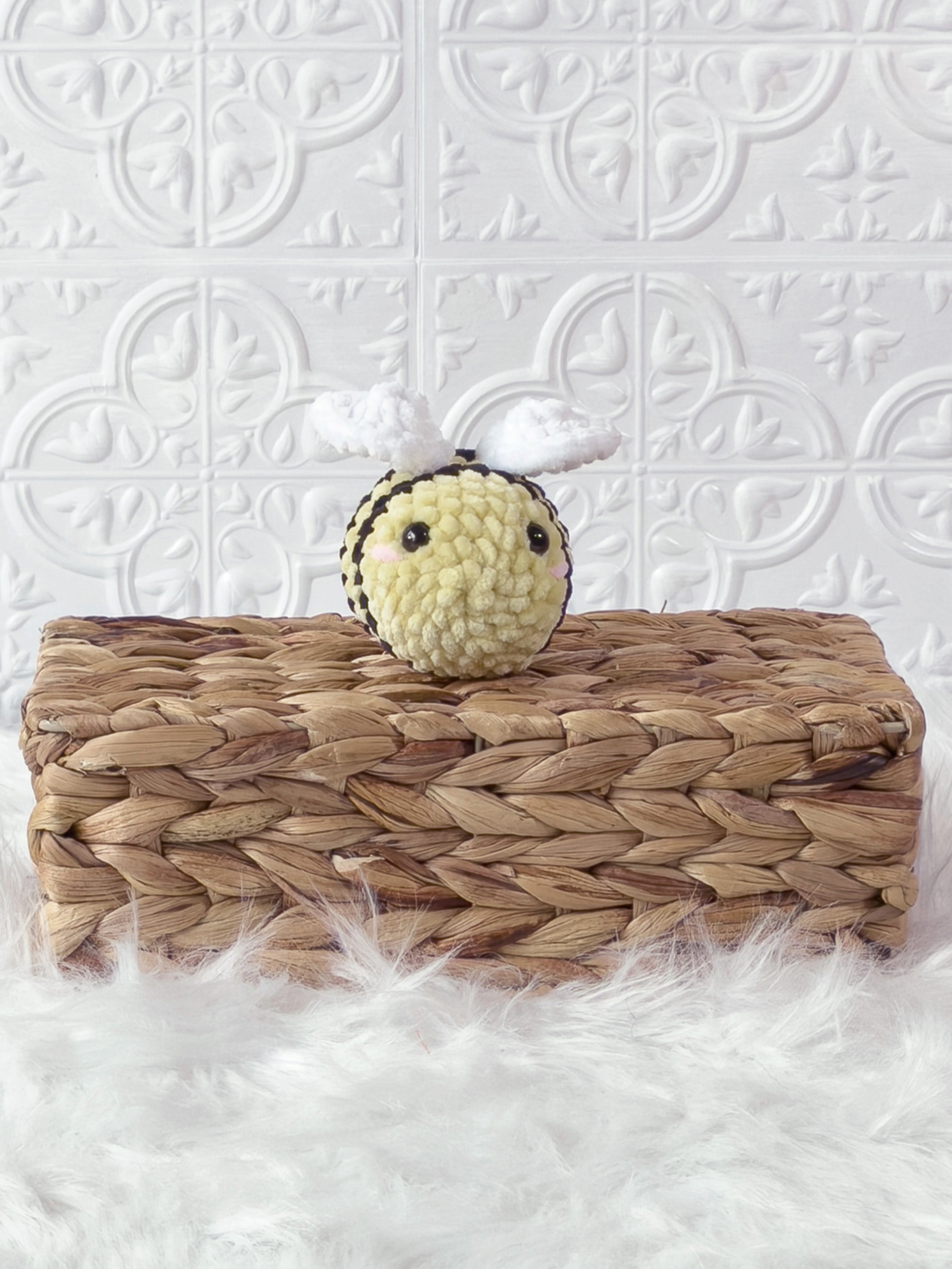 Handmade yellow mini bee crochet plushie shown from the front