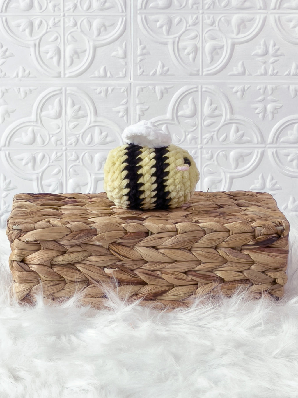Handmade yellow mini bee crochet plushie shown from the side