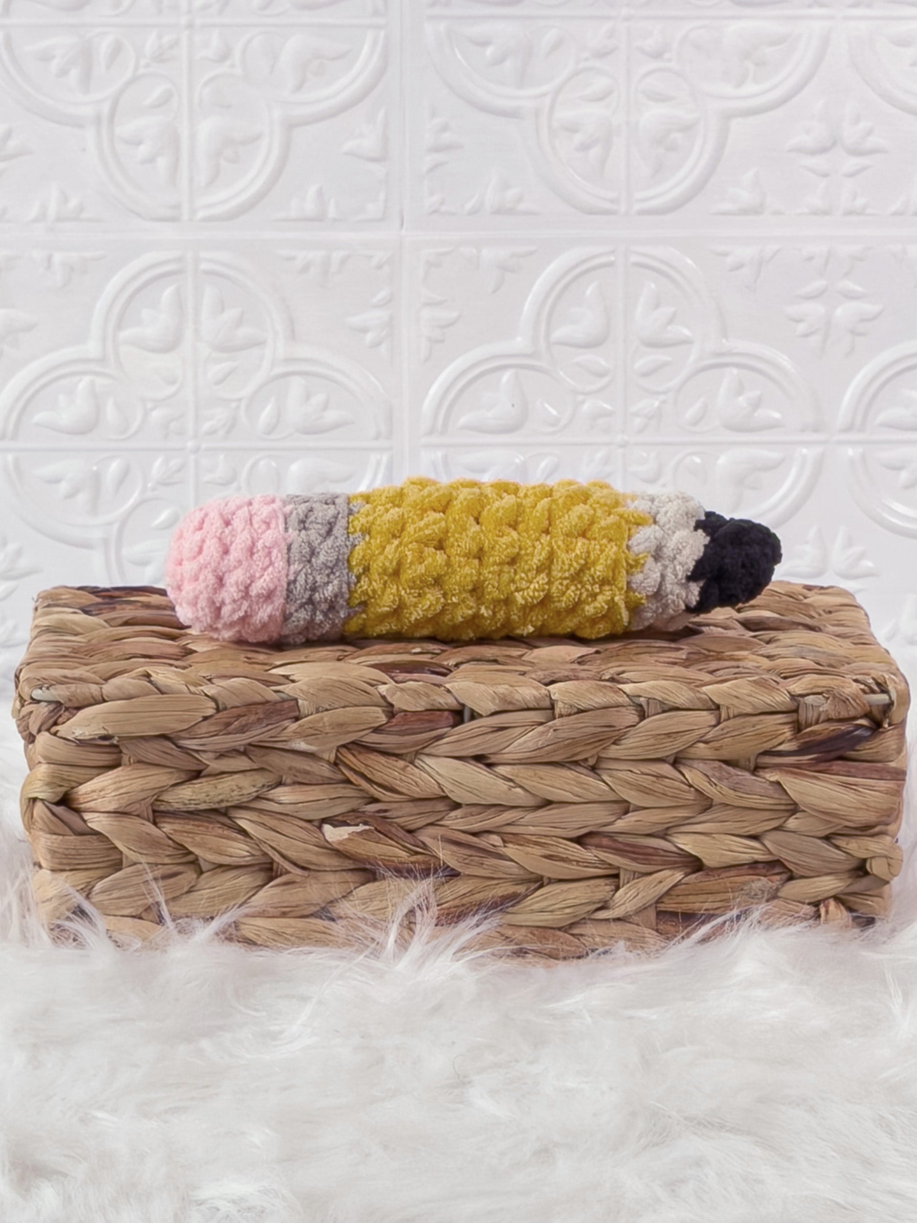 Handmade pencil crochet plushie with a colourful school-inspired design
