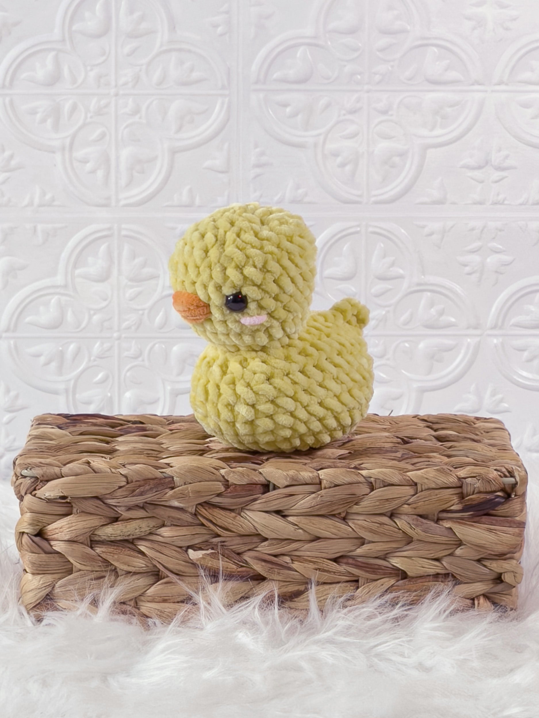 Handmade rubber duck crochet plushie shown from the front
