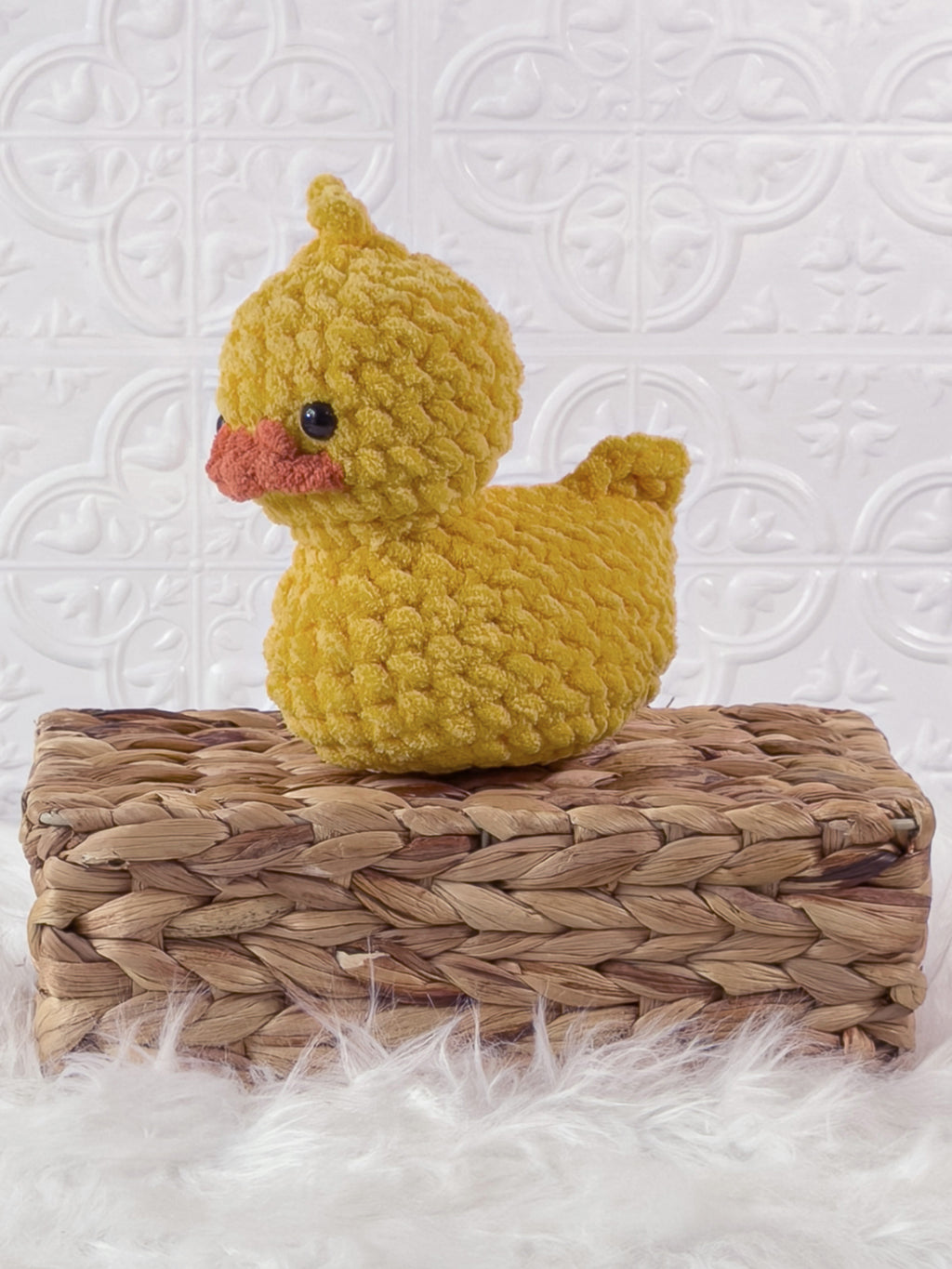 Handmade rubber duck crochet plushie shown from the front