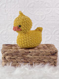 Handmade rubber duck crochet plushie shown from the front