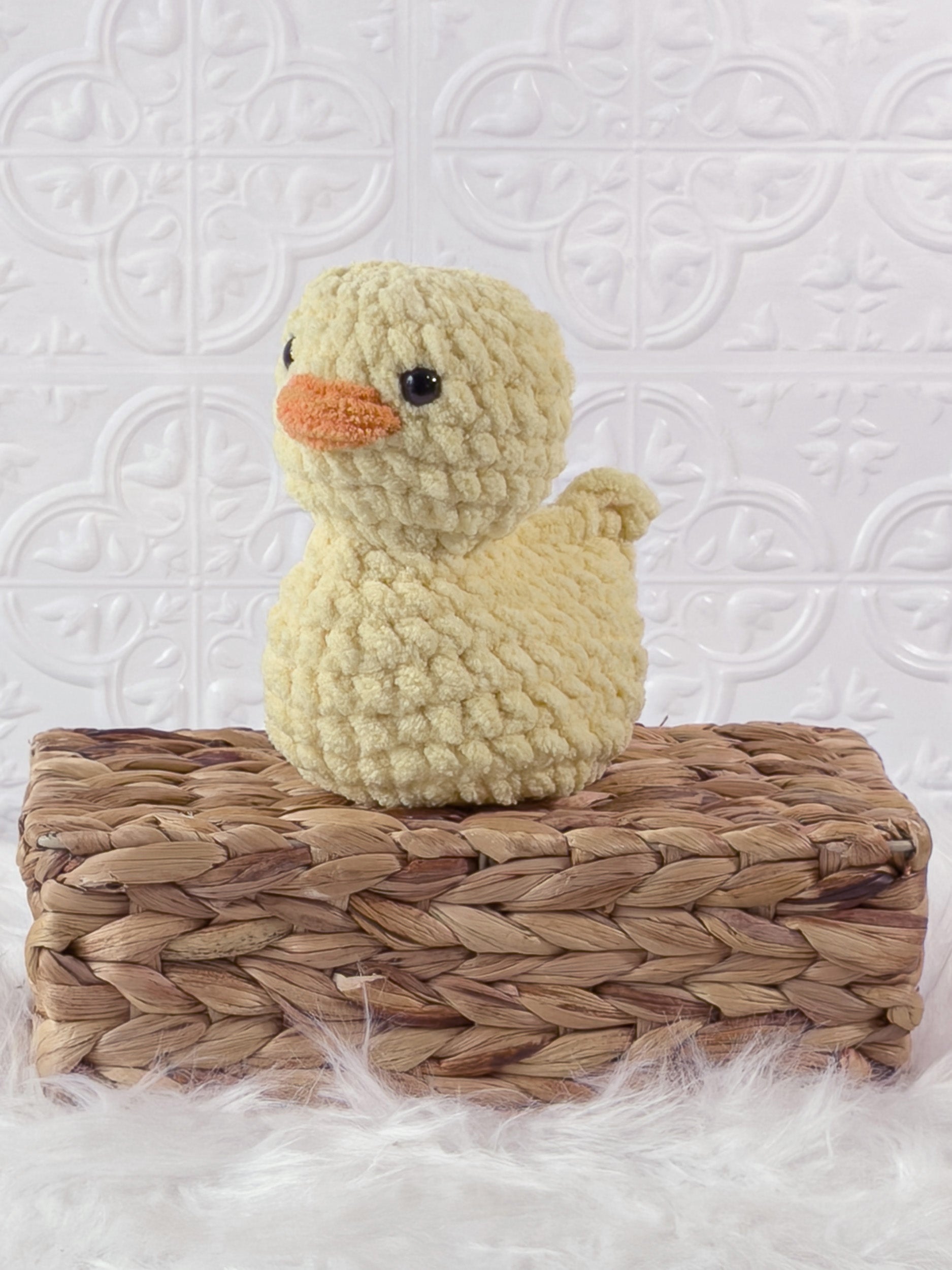 Handmade rubber duck crochet plushie shown from the front