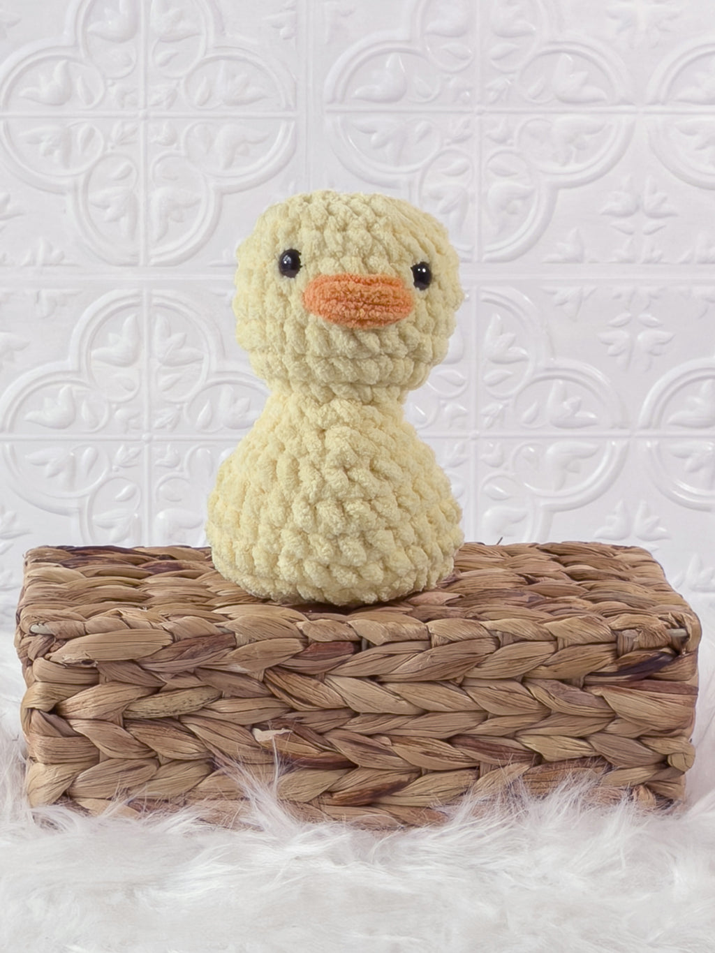 Handmade yellow, light rubber duck crochet plushie shown from the front