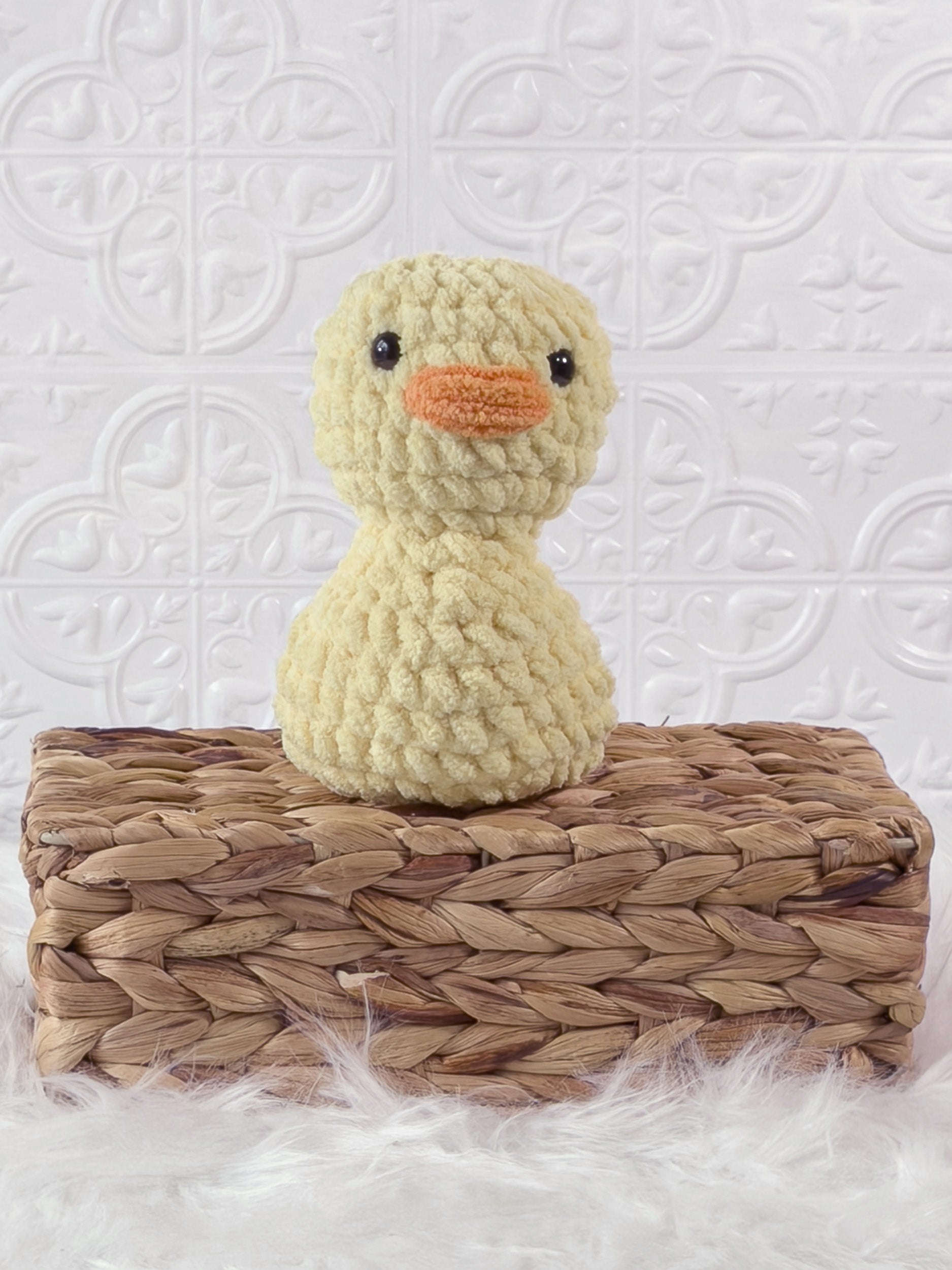 Handmade yellow, light rubber duck crochet plushie shown from the front