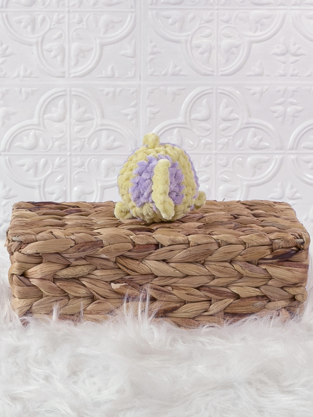 Handmade yellow, purple mini fish crochet plushie shown from the back