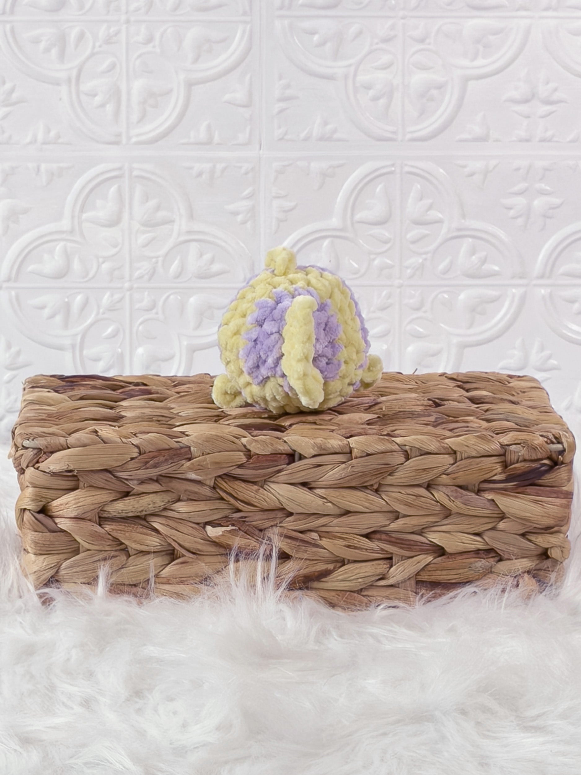 Handmade yellow, purple mini fish crochet plushie shown from the back