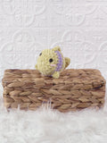Small handmade fish crochet plushie shown from the front